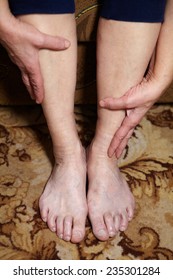 Legs Of Senior Woman. Feet Care And Massage