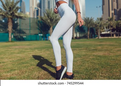 Legs Of A Sexy Girl In White Leggings. Mock-up. Outdoor.