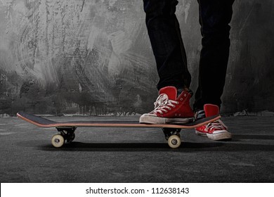 Legs in sneakers on a skateboard - Powered by Shutterstock