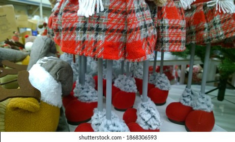 Legs Of Soft Dolls In Red Shoes And Skirts. Crafters Virtual Christmas Fair. Cute Handmade Gift. Happy New Year. Online Trade Show During Pandemic. Xmas Collection. Sewing Craft Product . Shopping.