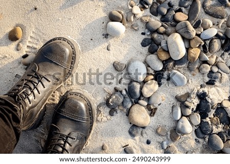 Similar – Image, Stock Photo Sunset, stone beach with small and large rocks in front of the illuminated sea