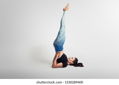 Legs Up To The Wall Yoga Pose, Woman On White Background, Studio Photos