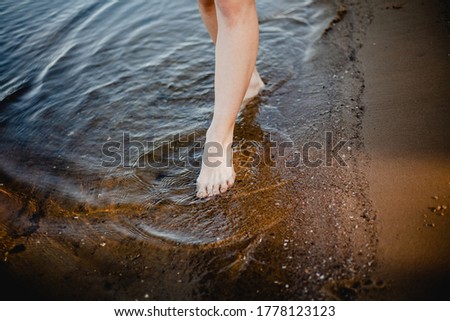 Legs in the water on a summer day
