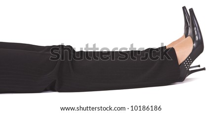 Legs of a woman wearing black trousers and lying on the floor. Stock photo © 
