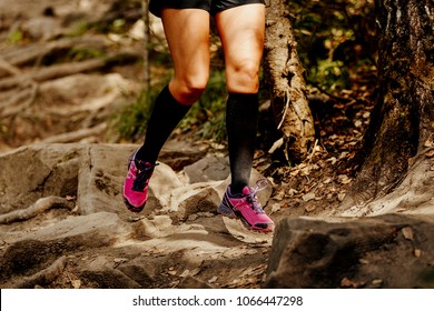 Legs Women Runner In Compression Socks Running On Stones In Forest