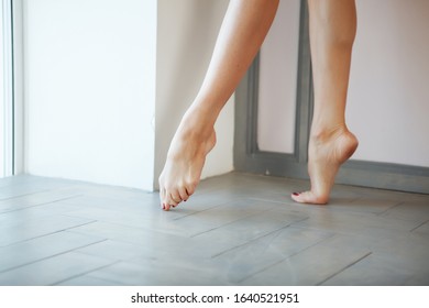 Legs of young skinny attractive dancer woman near the window - Shutterstock ID 1640521951