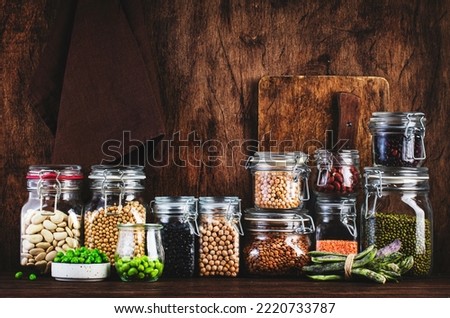 Legumes and beans. Dried, raw and fresh. Lentils, chickpeas, mung beans, soybeans, edamame, peas in glass jars. Healthy diet food, vegan protein, micronutrients and fiber sources