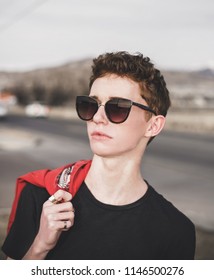 Lehi, UT / United States - January 15, 2018: Young Man Model Posing On Road In City 