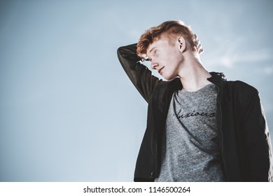 Lehi, UT / United States - October, 20 2016: Young Ginger Model Posing Up At Sky  