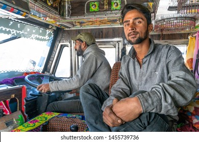 Leh/India-24.10.2018:The Portrait Of Indian Truck Driver And His Helper