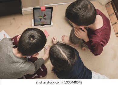 Leicester, Leicestershire, United Kingdom. 22 February 2019. School Age Kids Learning And Enjoying On Osmo, A Platform Using IPads To Aid Learning & Development - Maths, Numbers, Spatial Orientation.