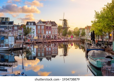 Leiden Old town cityscape, view of the Beestenmarkt and the De Valk mill reflecting in Rhine river on sunrise, South Holland, Netherlands