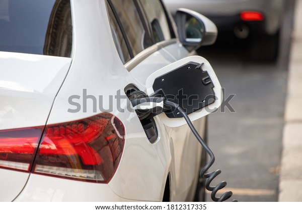 Leipzig, Germany, 09-08-2020\
Charging cable and plug of an electric car during the charging\
process