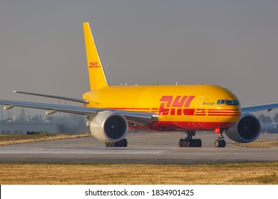Leipzig, Germany - August 19, 2020: DHL Boeing 777F airplane at Leipzig Halle LEJ Airport in Germany. Boeing is an American aircraft manufacturer headquartered in Chicago.