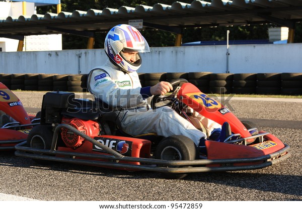 LEIRIA, PORTUGAL - JANUARY 28: An uknown\
driver/team participating in Old Motor Club Of Marinha Grande\
Karting Race, organized by Motor Club Of Marinha Grande, in Leiria,\
Portugal on January 28,\
2012.