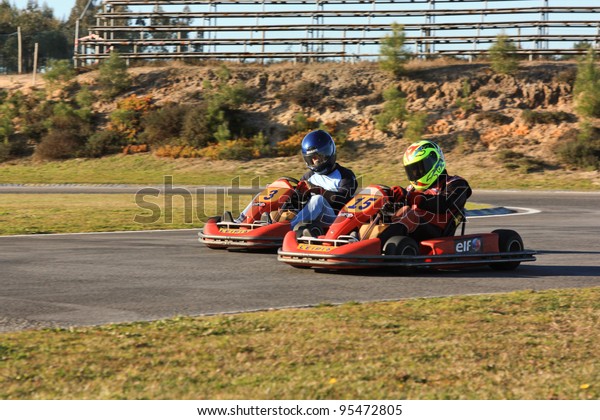 LEIRIA, PORTUGAL - JANUARY 28: An unknown\
driver/team participating in Old Motor Club Of Marinha Grande\
Karting Race, organized by Motor Club Of Marinha Grande, in Leiria,\
Portugal on January 28,\
2012.