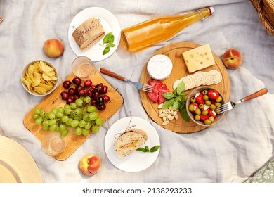 Leisure And Eating Concept - Close Up Of Food And Drinks On Picnic Blanket