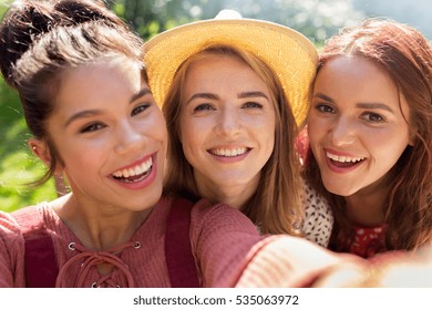 leisure, holidays and people concept - happy women or friends taking selfie at summer - Powered by Shutterstock