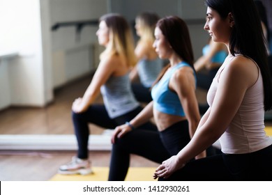 Leisure, sport, fitness, yoga class, relaxation, balance flexibility Fit women practicing yoga in studio