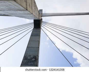 Lekki-Ikoyi Toll Bridge in Lagos, Nigeria. Concrete bridge columns with cable stays; Urban city transportation architecture structure, viewed from below.