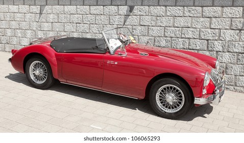 LELYSTAD, THE NETHERLANDS - JUNE 17: A 1957 MG A on display at the annual National Oldtimer day on June 17, 2012 in Lelystad, The Netherlands - Shutterstock ID 106065293