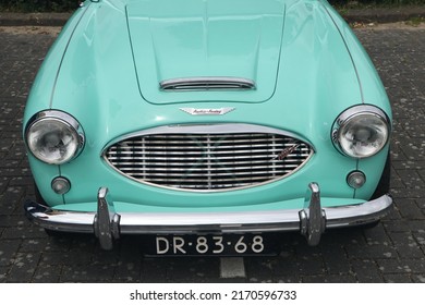 Lelystad, The Netherlands - June 19 2022: Front Of Turquoise Blue Austin Healey Car On Old Timer Day