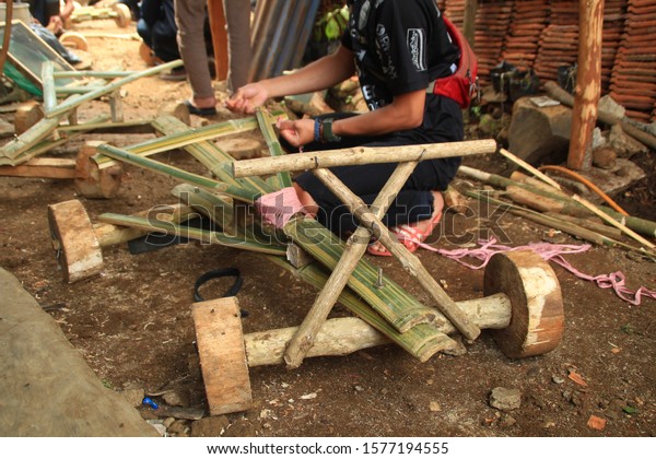 Lembang,\
West Java, Indonesia - (21/11/2019): Kadaplak Traditional bamboo\
car game in Batu Lonceng, Lembang,\
Indonesia.