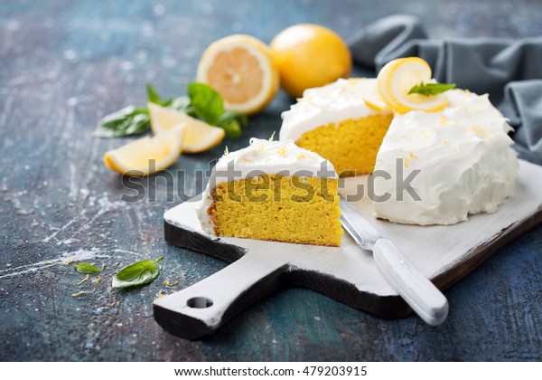 Lemon almond gluten free cake with cream cheese\
frosting, selective focus
