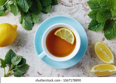Lemon balm tea with honey. Cup of hot honey lemon balm tea. Lemon balm is a herb that belongs to the mint family and is known for its medicinal benefits. 