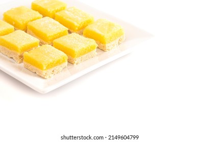 Lemon Bars On A Square Dish On A White Background