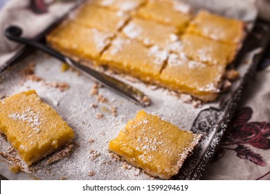 Lemon Brownies Cut in Squares with Powdered Sugar - Shutterstock ID 1599294619