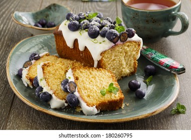 Lemon Cake With Blueberry Glaze.