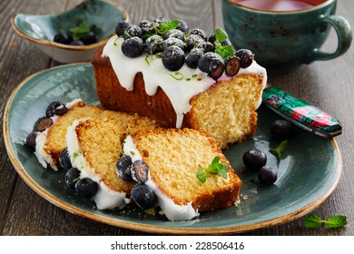 Lemon Cake With Blueberry Glaze.