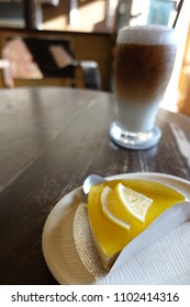 Lemon Cake With Coffee On Wooden Table