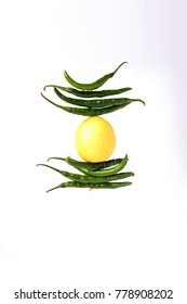 Lemon Chilies Tied With Thread And Tied For Hanging On Doors At Home OR Shop To Avoid Any Bad Fortune Also Known As Totka Or Nazar Battu