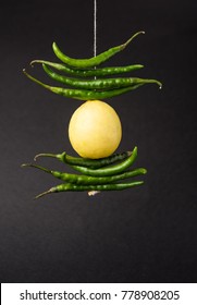 Lemon Chilies Tied With Thread And Tied For Hanging On Doors At Home OR Shop To Avoid Any Bad Fortune Also Known As Totka Or Nazar Battu