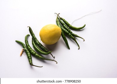 Lemon Chilies Tied With Thread And Tied For Hanging On Doors At Home OR Shop To Avoid Any Bad Fortune Also Known As Totka Or Nazar Battu