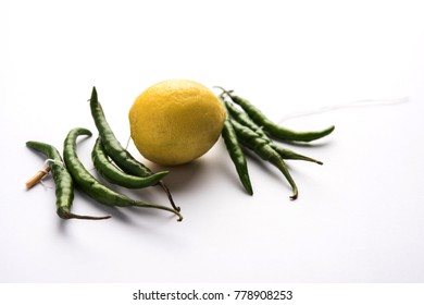 Lemon Chilies Tied With Thread And Tied For Hanging On Doors At Home OR Shop To Avoid Any Bad Fortune Also Known As Totka Or Nazar Battu