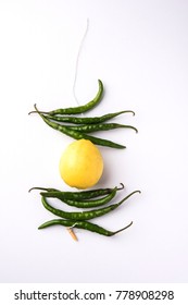 Lemon Chilies Tied With Thread And Tied For Hanging On Doors At Home OR Shop To Avoid Any Bad Fortune Also Known As Totka Or Nazar Battu