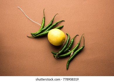 Lemon Chilies Tied With Thread And Tied For Hanging On Doors At Home OR Shop To Avoid Any Bad Fortune Also Known As Totka Or Nazar Battu