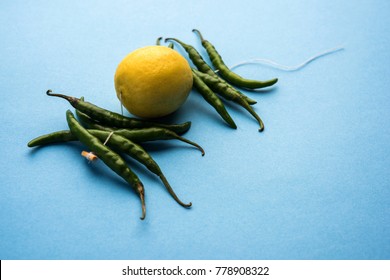 Lemon Chilies Tied With Thread And Tied For Hanging On Doors At Home OR Shop To Avoid Any Bad Fortune Also Known As Totka Or Nazar Battu