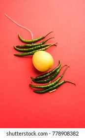 Lemon Chilies Tied With Thread And Tied For Hanging On Doors At Home OR Shop To Avoid Any Bad Fortune Also Known As Totka Or Nazar Battu