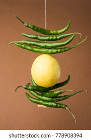 Lemon Chilies Tied With Thread And Tied For Hanging On Doors At Home OR Shop To Avoid Any Bad Fortune Also Known As Totka Or Nazar Battu