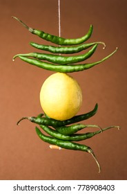 Lemon Chilies Tied With Thread And Tied For Hanging On Doors At Home OR Shop To Avoid Any Bad Fortune Also Known As Totka Or Nazar Battu