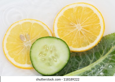 Lemon And Cucumber In The Water On A White Background