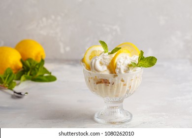 Lemon Dessert, Lemon Trifle, Cheesecake, Whipped Cream, Parfait. Fruit Mousse In Glass On A Light Background.