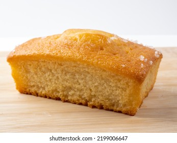 Lemon Drizzle  Loaf Tin Cake Isolated On A Bamboo Board