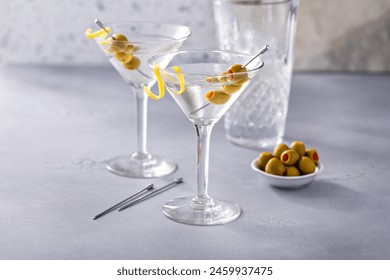 Lemon drop martini cocktail with olives and a lemon twist in a traditional glass - Powered by Shutterstock