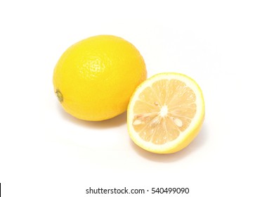 Lemon fruit with leaf isolated on white.