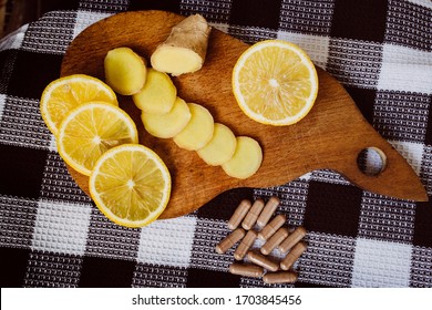 Lemon And Ginger Lie On A Wooden Board. Tablets. Vitamins Fight Against A Virus. Seasoning. Flu. Sore Throat. Food.natural Antibiotic